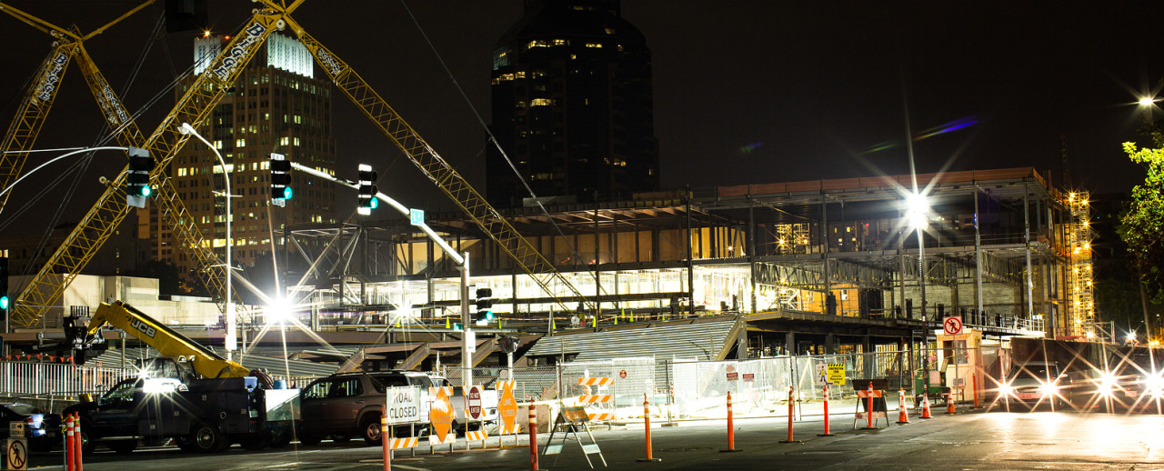 Image of cranes in downtown sacramento working on constructing a building