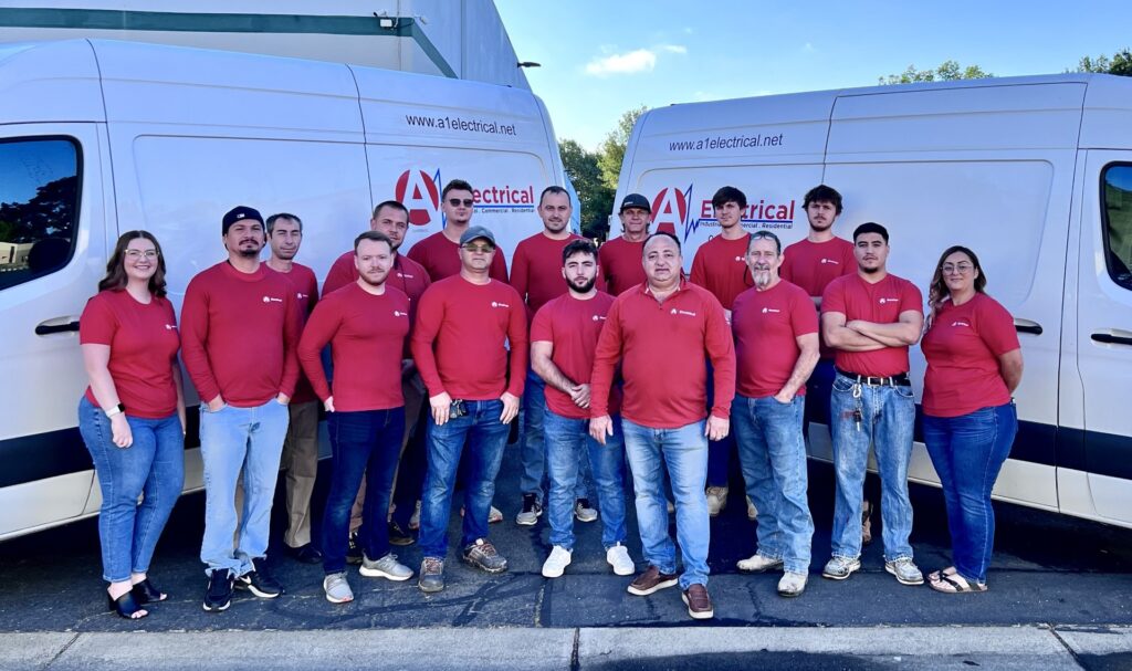 About us - team in front of our company trucks.